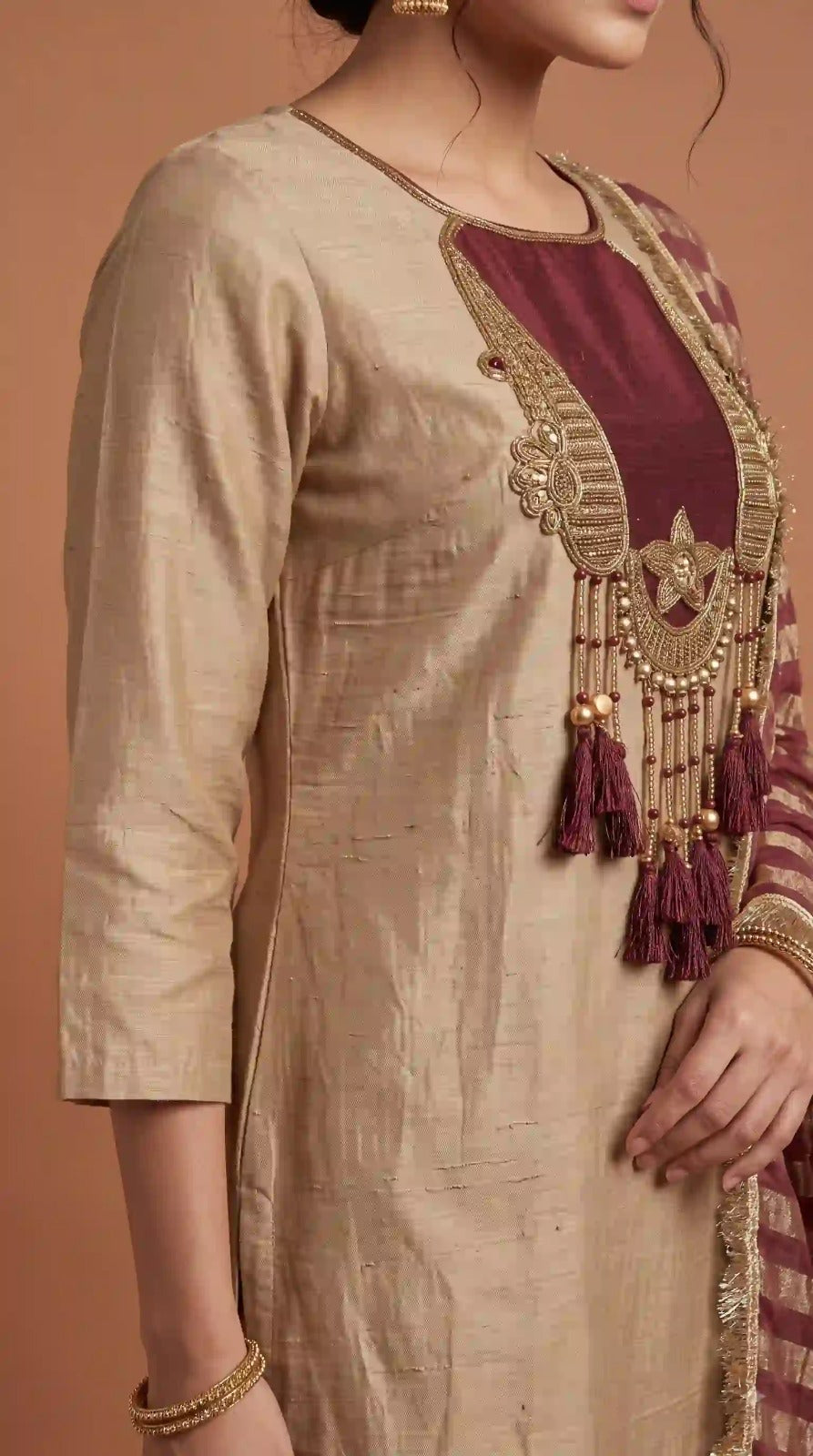 Handcrafted tassel neckline on beige glass malai kurti – close-up