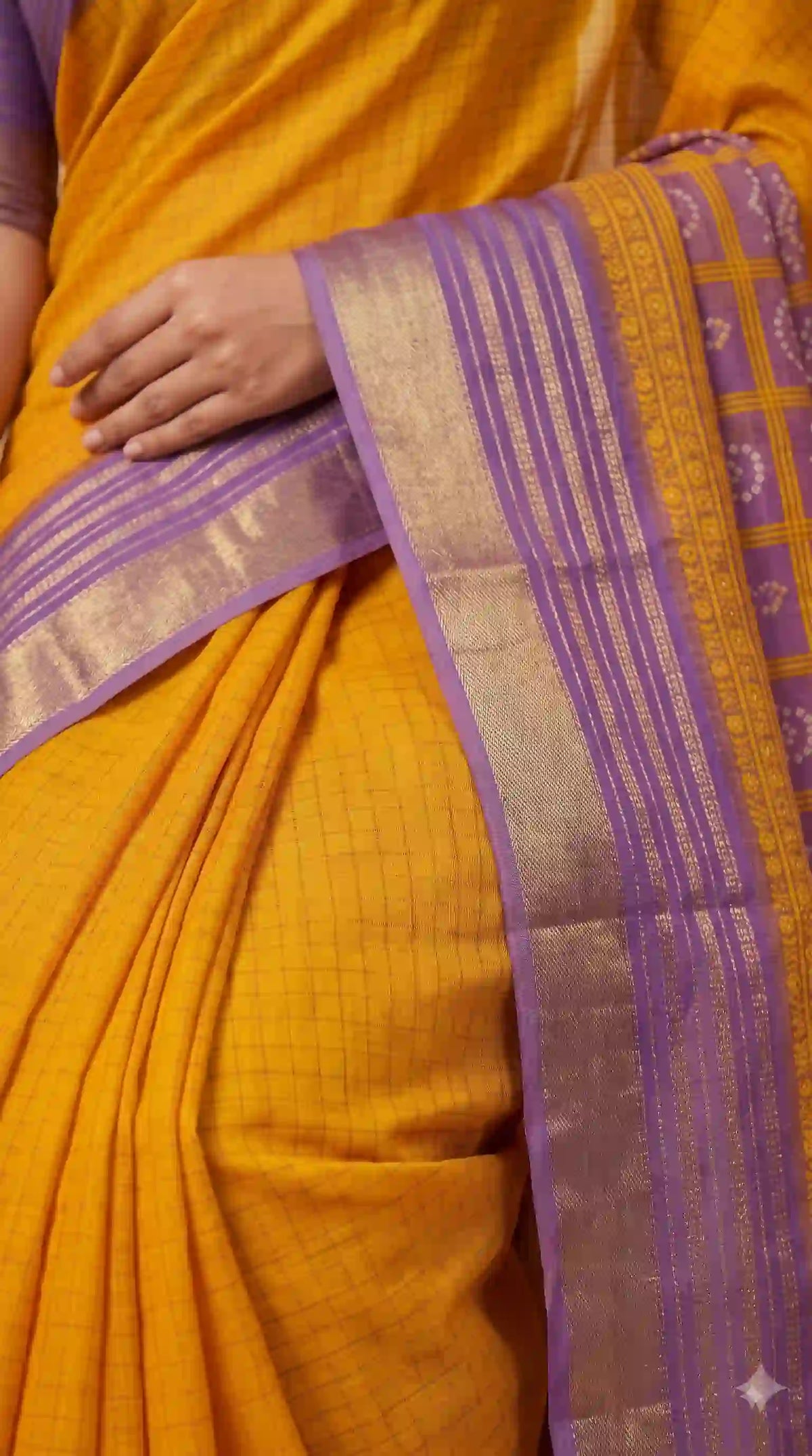 Check weave and purple border on mustard saree – close-up