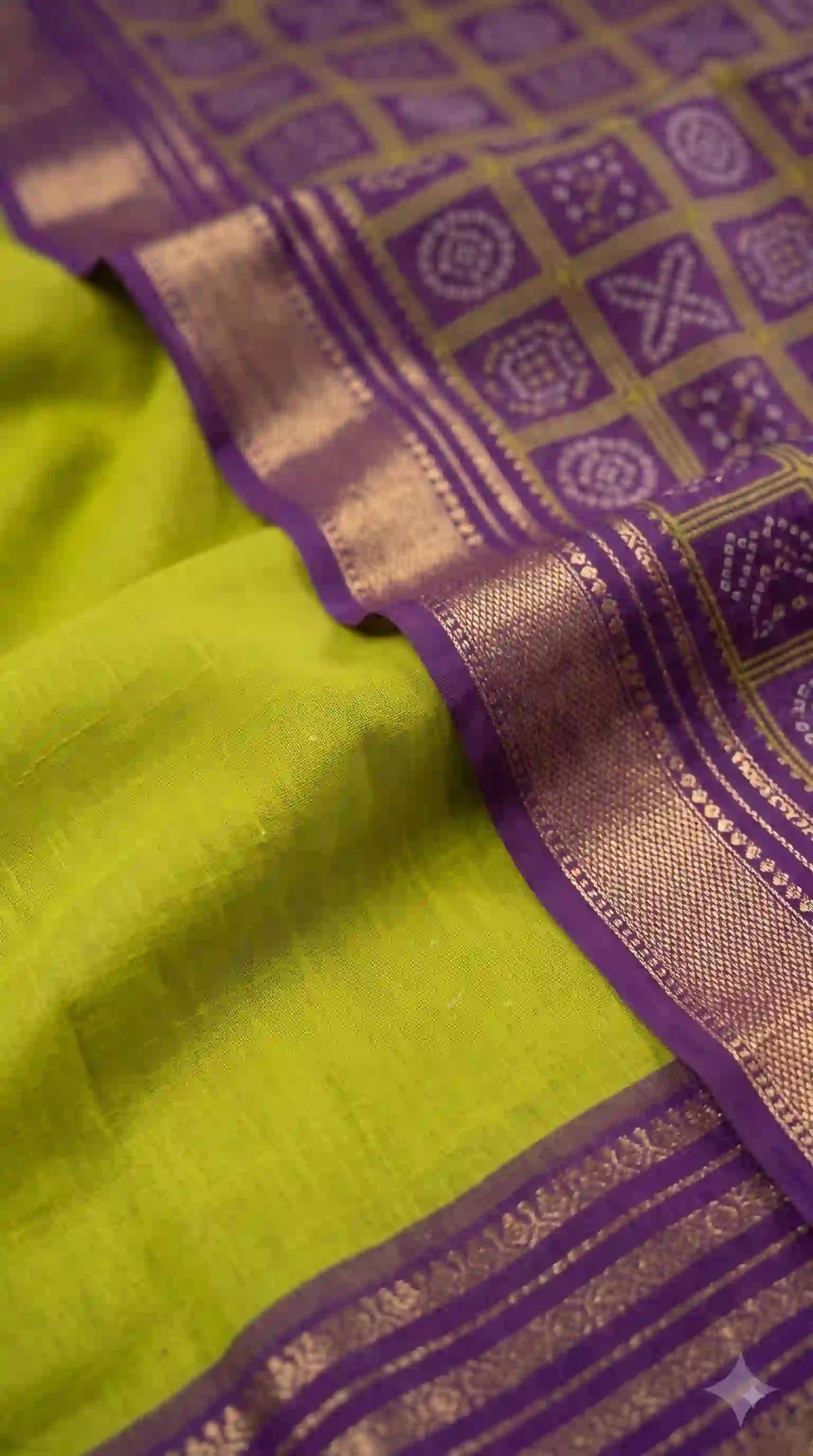 Woven purple pallu on parrot green Mysore silk – close-up