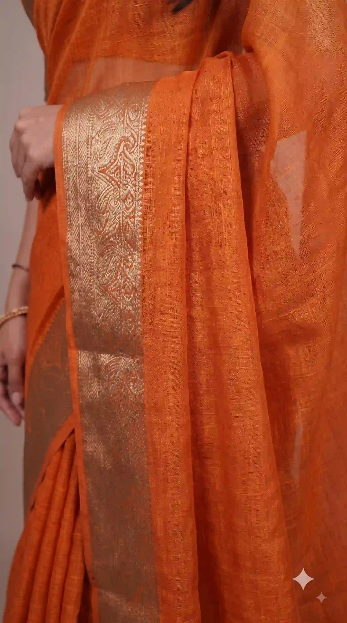 Zari border on orange marshmallow saree – close-up