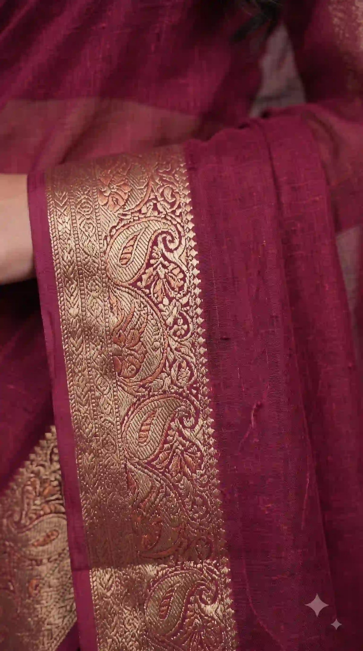 Zari weaving border on wine saree – close-up