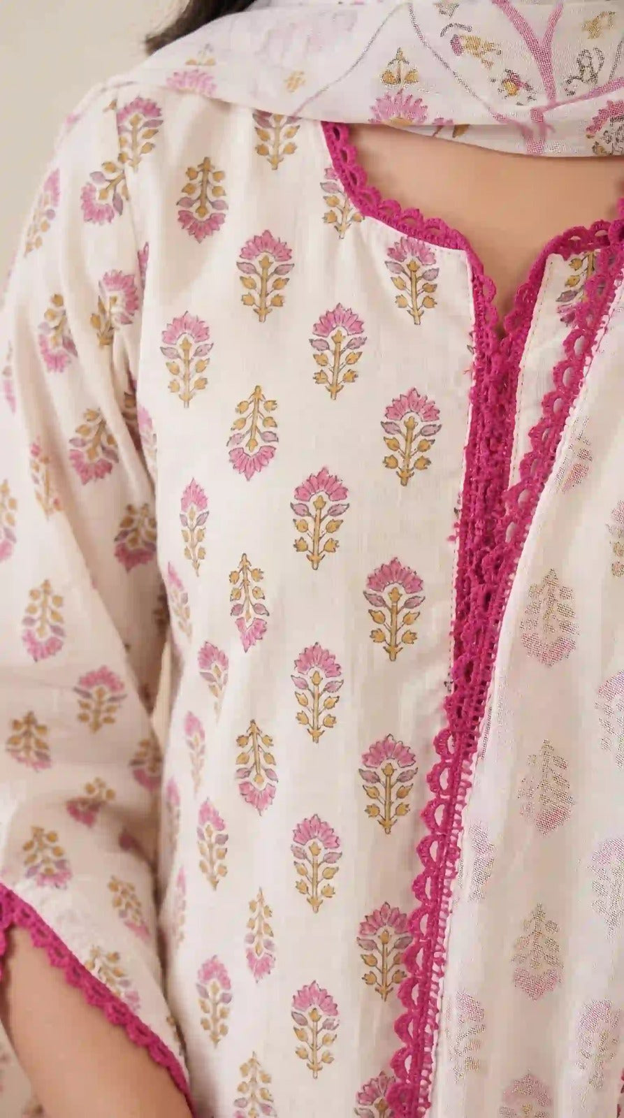 Pink lace neckline on white floral crepe top – close-up