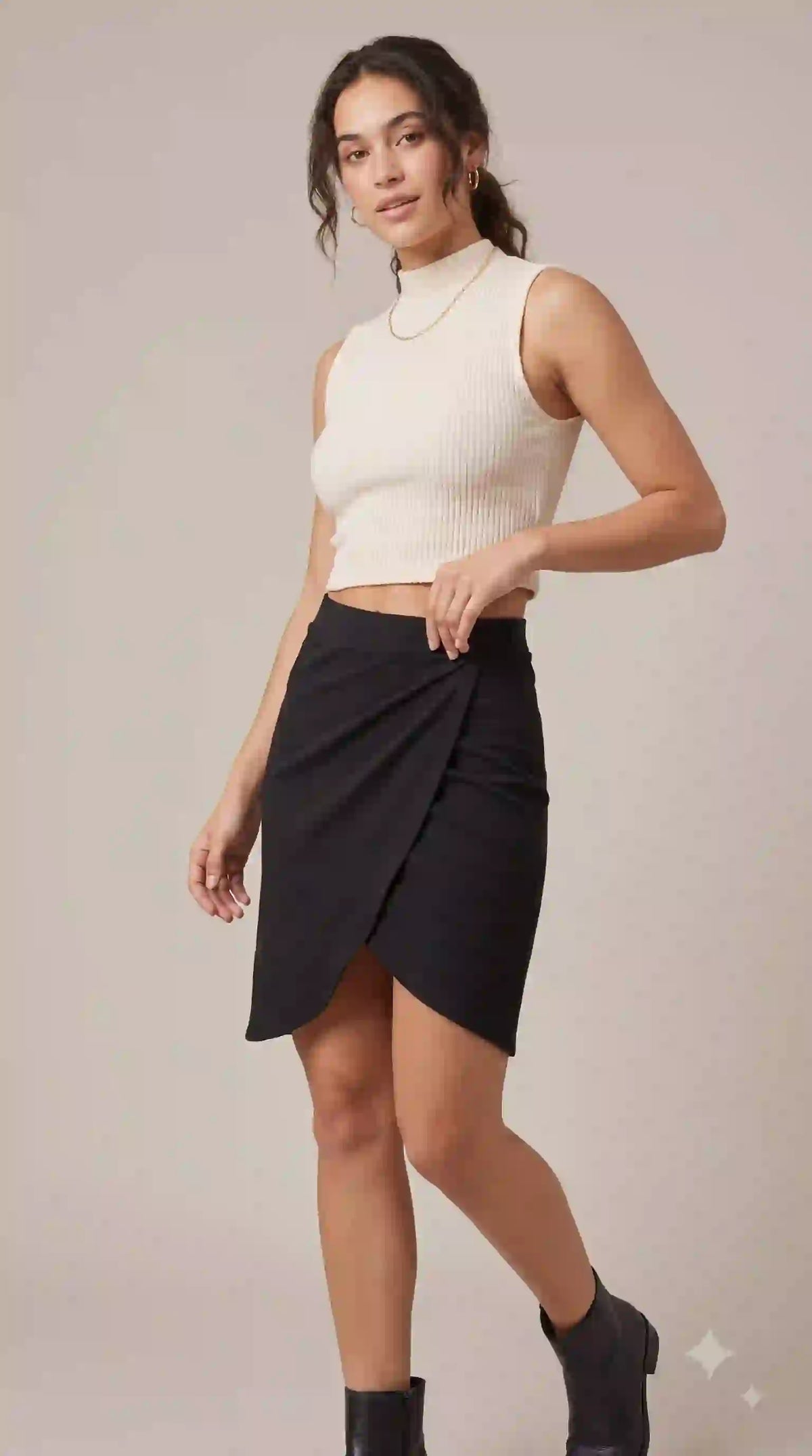 Black wrap-style mini skirt – styled with cream crop top | TIGIQ